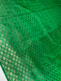A close-up of bright green mesh fabric or netting with a diamond-pattern grid, draped with visible folds and texture.